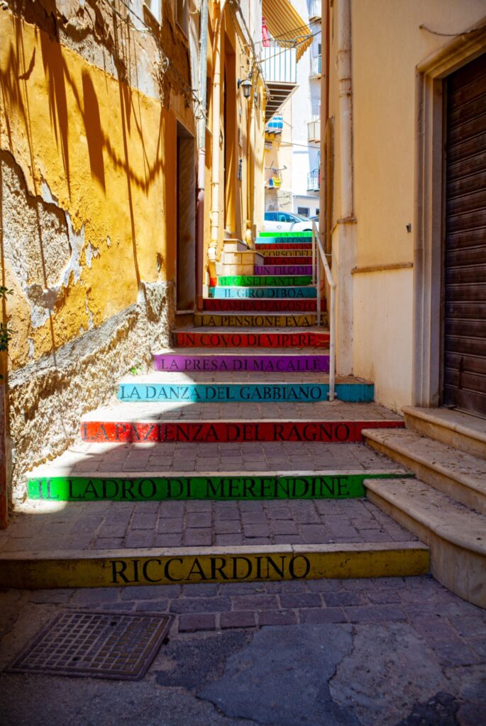 Coloured staircase with book titles in Sicily.