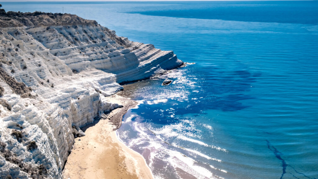 White cliffs on the crystal clear sea in Sicily.